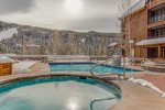 Outdoor shared pool and hot tubs onsite at Dakota Lodge